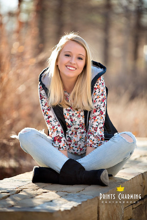 McKinsey high school senior portraits outdoors sitting on stone wall by brown grasses McKR_5492