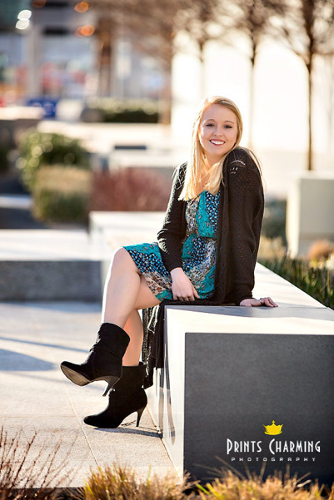 McKinsey's high school senior portrait photography outdoors smiling and sitting on marble bench with modern landscaping McKR_5589