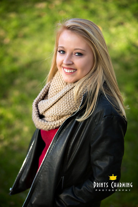 McKinsey's high school senior portrait photography outdoors smiling with green grass behind - McKR_5683