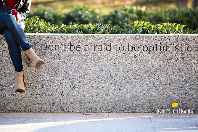 McKinsey's high school senior portrait photography outdoors sitting on marble bench with modern landscaping and quote don't be afraid to be optimistic - McKR_5736