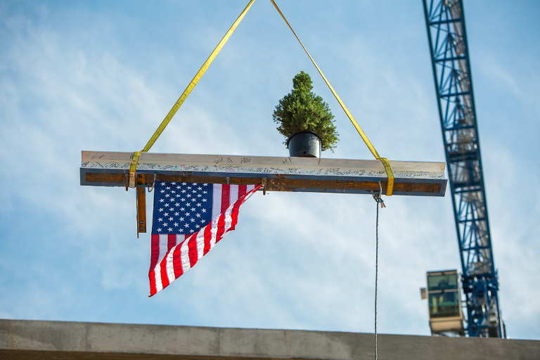 Crane lifts the i-beam with a tree on top for a tree-topping ceremony on new St. Anthony Hospital building in OKC