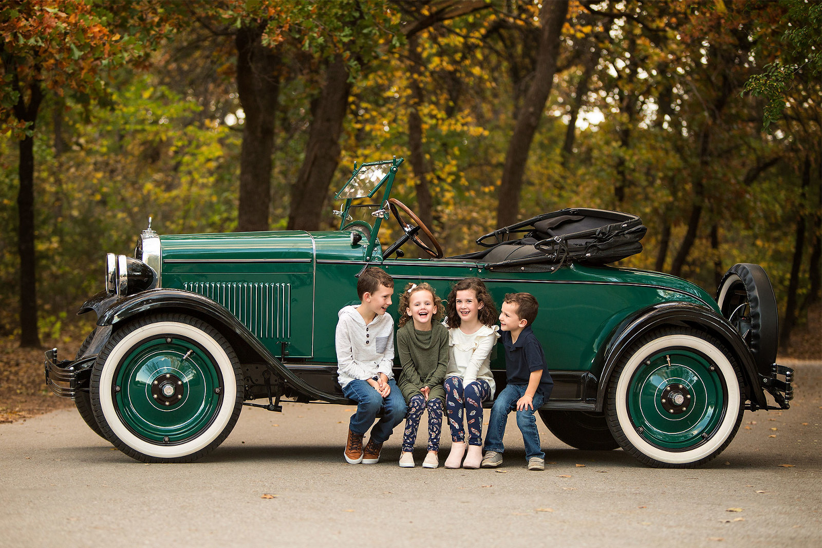 Kids and antique Chevrolet couple