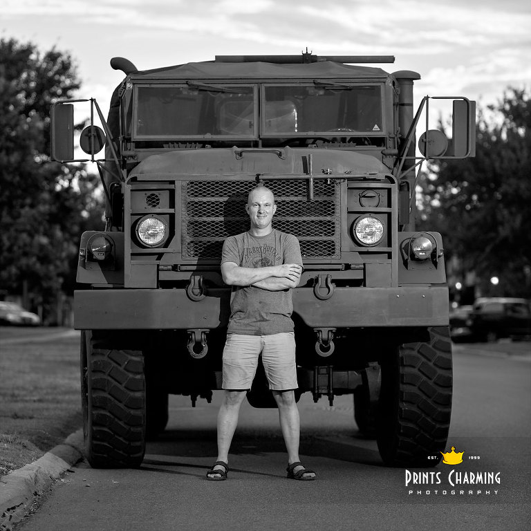 Arms folded scott with 5-ton truck in B&W